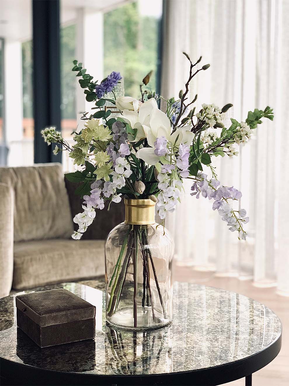 flower in a vase sat on the table